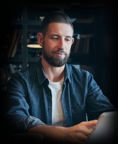 young-man-drinking-coffee-cafe-using-tablet-computer-freelancer-workplace-lunch-1.jpg